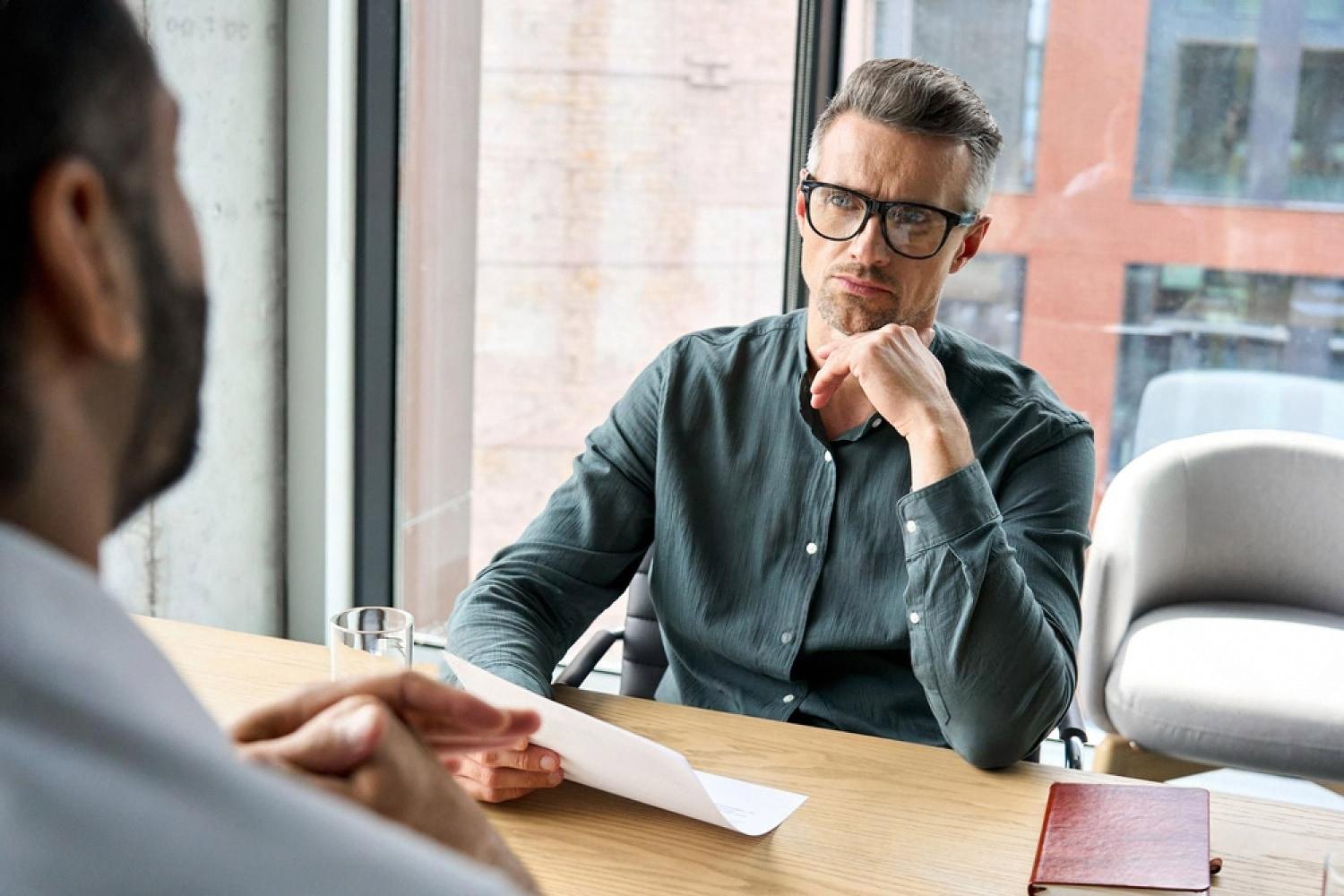 Manager reviewing an employee assessment during an HR consulting session